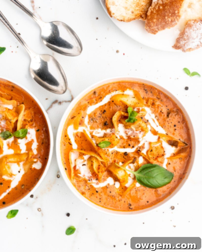 This Creamy Tomato and Tortellini Soup is vibrant in color and full of flavor. Made with San Marzano tomatoes, cream, cheesy tortellini, and a touch of white wine.