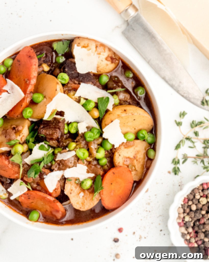 Melt in your mouth pieces of chuck steak, vibrant thick cut carrots, buttery baby potatoes, and brightly flavored peas are braised in a red wine liquid to create a delicious and hearty beef stew