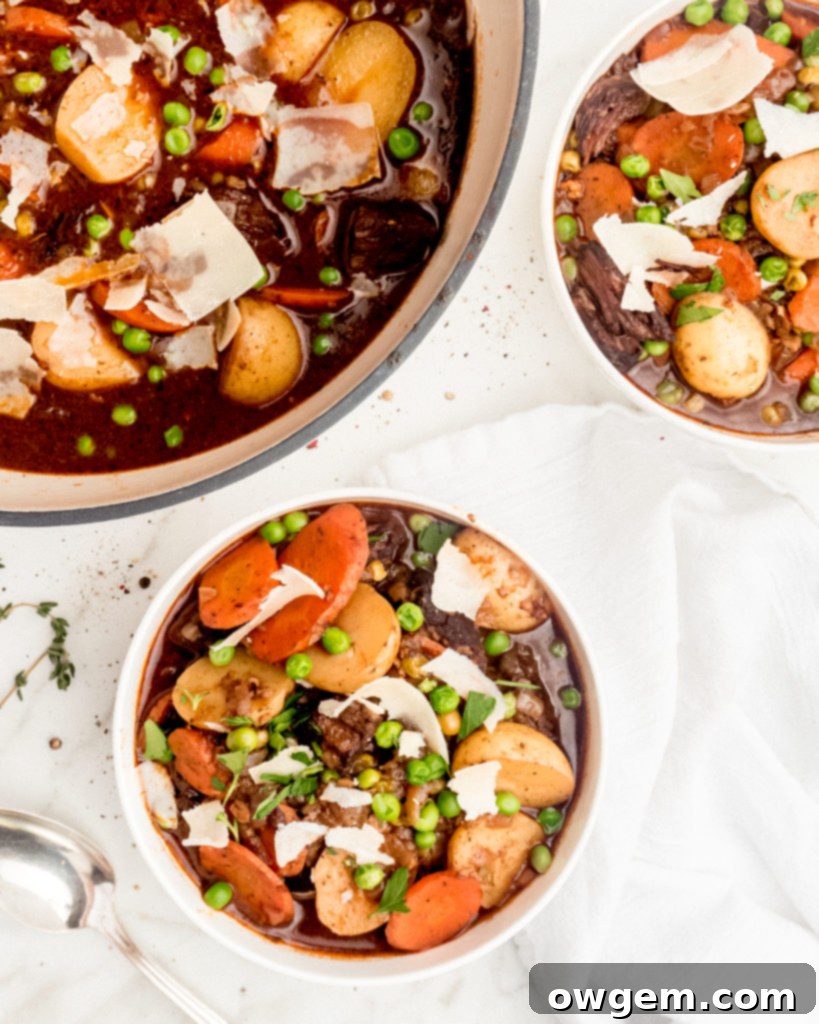 Melt in your mouth pieces of chuck steak, vibrant thick cut carrots, buttery baby potatoes, and brightly flavored peas are braised in a red wine liquid to create a delicious and hearty beef stew