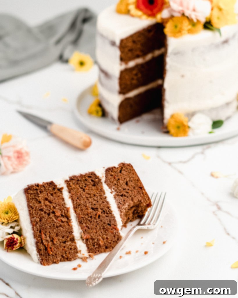 Carrot Cake Perfection: Ultra Moist with Cream Cheese Frosting 6 A beautifully decorated three-layer ultra moist carrot cake with a semi-naked cream cheese frosting and fresh edible flowers on top, perfect for Spring celebrations.