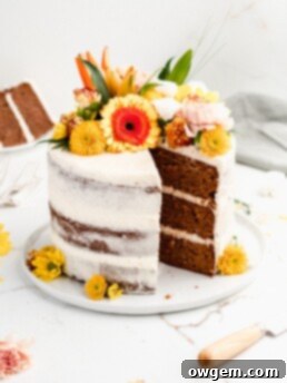 Carrot Cake Perfection: Ultra Moist with Cream Cheese Frosting 7 Close-up of a perfectly sliced piece of ultra moist carrot cake with layers of cream cheese frosting, showcasing its inviting texture.