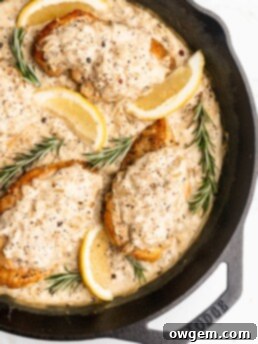 A delicious pan sauce is made after searing chicken breasts, with white wine, onions, shallots, rosemary, cream, mustard, and maple syrup.