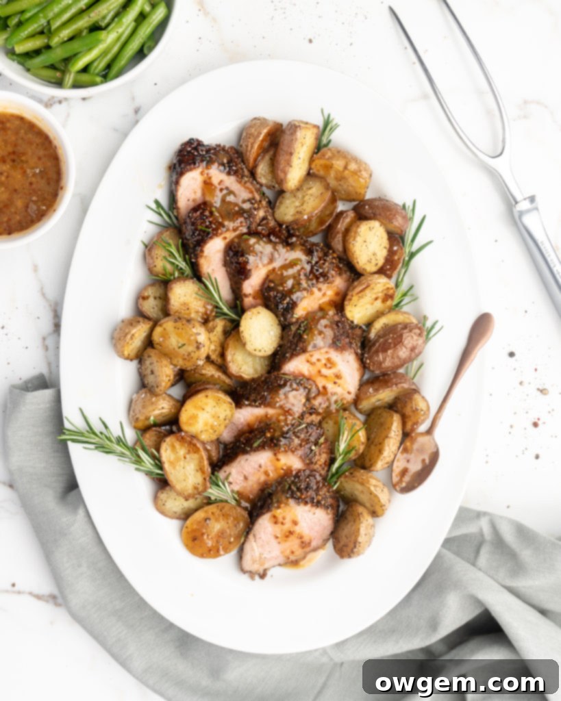 Perfectly seared pork tenderloin crusted with black peppercorns, ready to be glazed with rosemary peach mustard sauce.