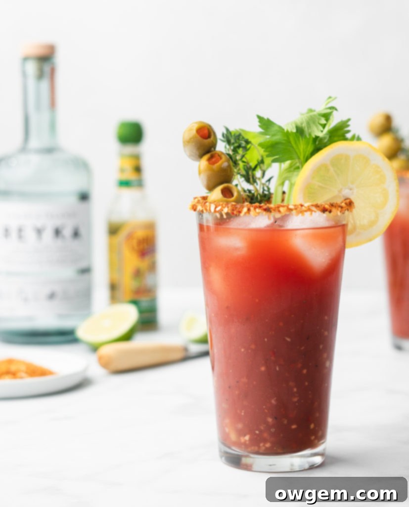 A close-up of the prepared Best Caesar cocktail mix in a glass jar.