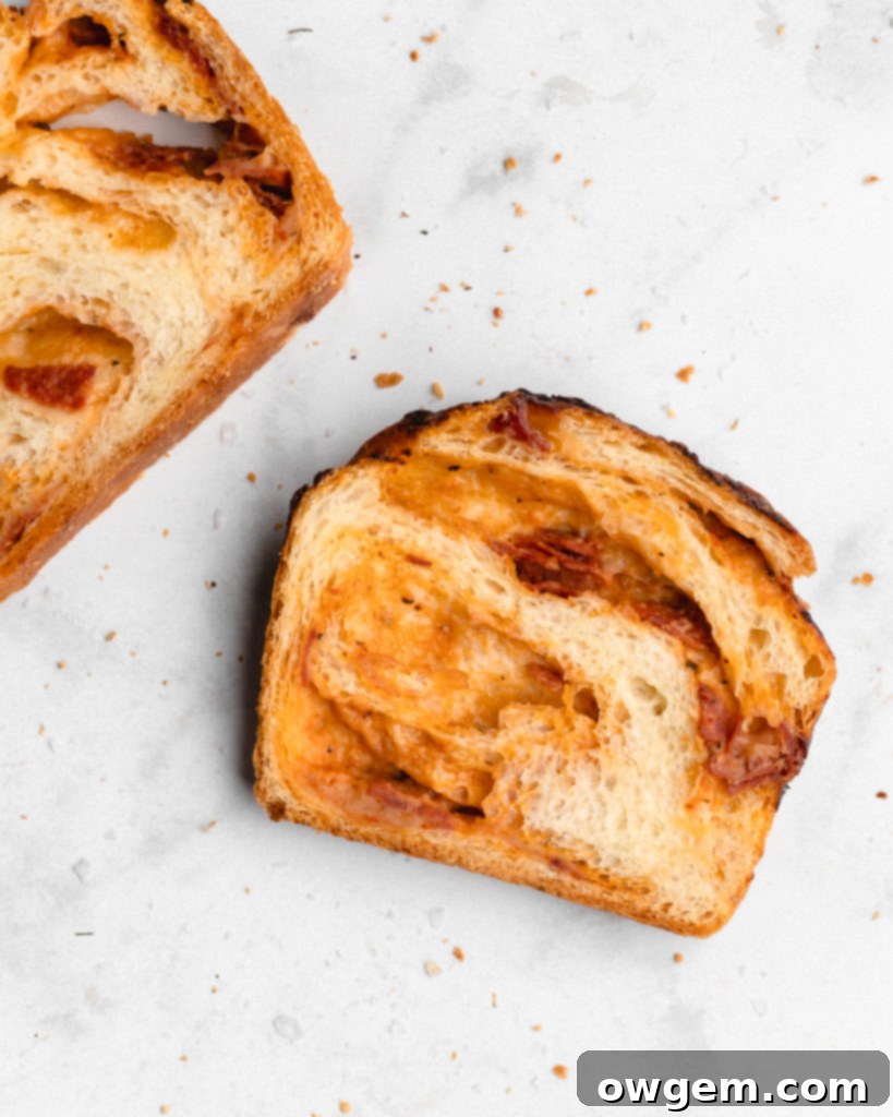 This braided Pizza bread features marinara, mozzarella, and parmesan as a filling, which is then sliced and braided into the bread to create an artistic looking bread