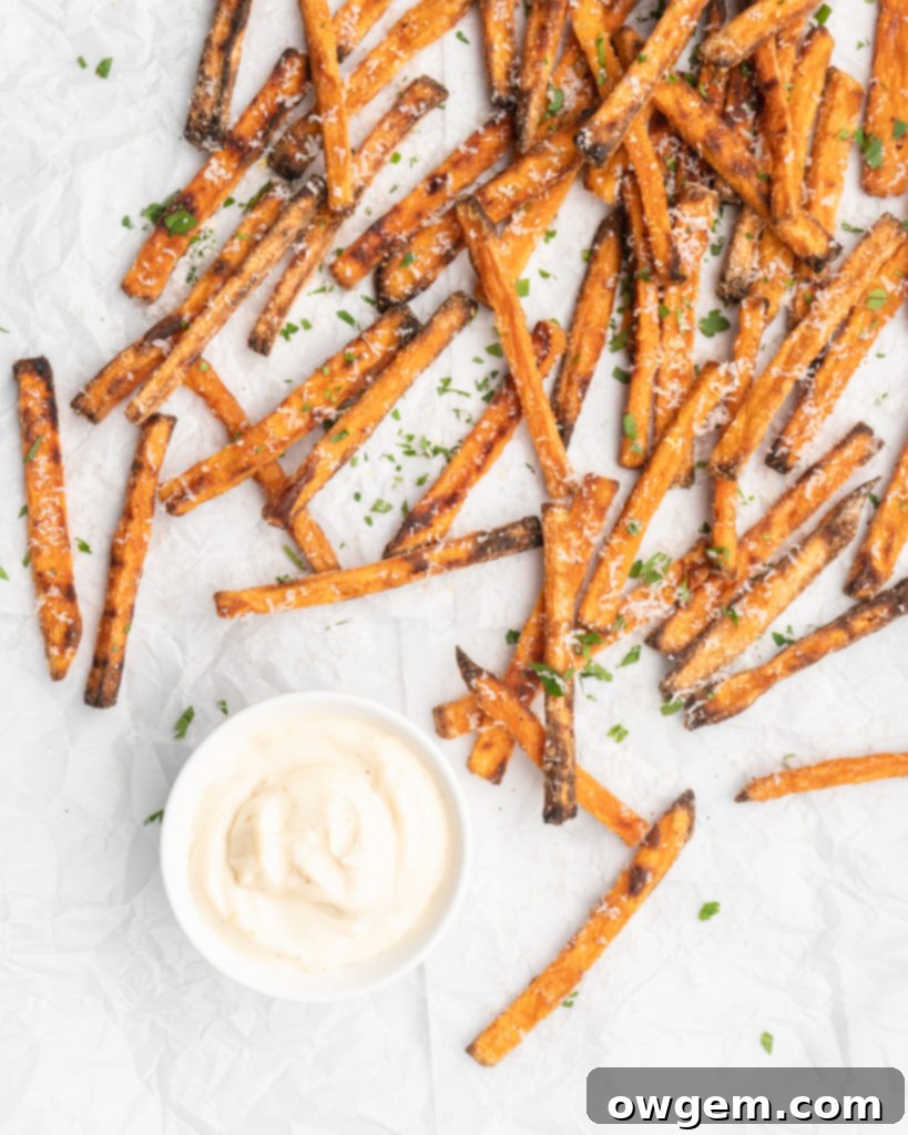Crispy oven baked sweet potato fries, perfectly golden, ready to be seasoned