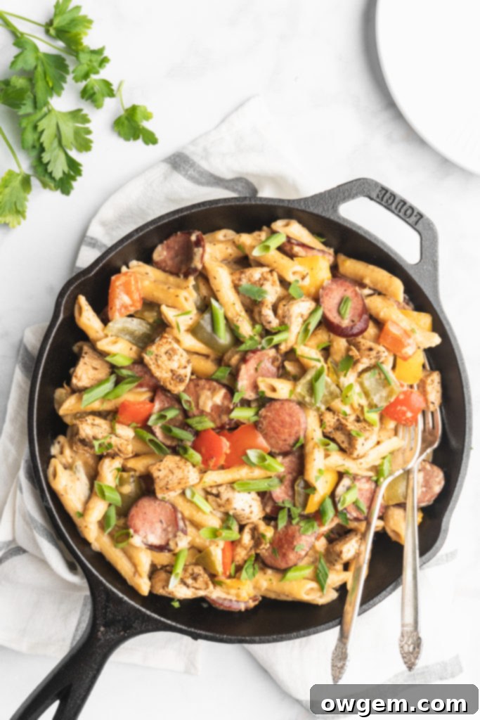 Penne, cream, peppers, onions, cajun chicken, and garlic sausage make up this easy and delicious one pot recipe.