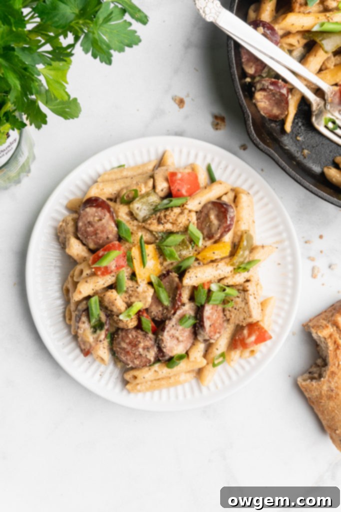 Penne, cream, peppers, onions, cajun chicken, and garlic sausage make up this easy and delicious one pot recipe.