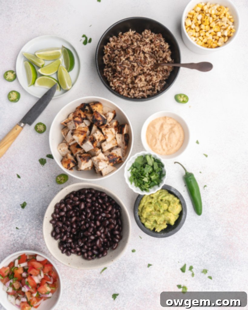 Beautifully plated Tequila Lime Grilled Chicken Burrito Bowl with brown rice, black beans, corn, grilled chicken, and fresh cilantro, highlighting its meal prep suitability.