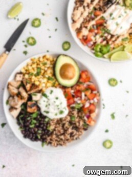A delicious Tequila Lime Grilled Chicken Burrito Bowl with all its vibrant ingredients.
