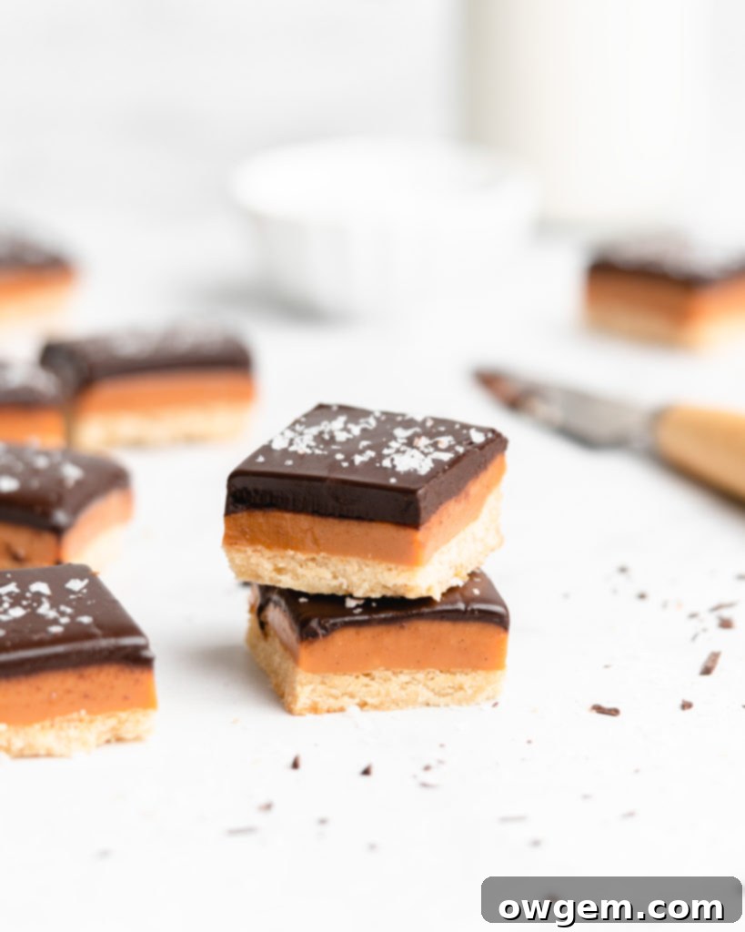 A buttery, rich shortbread layer is topped with a golden creamy caramel layer that is infused with vanilla beans an bourbon, which is further topped by a dark chocolate layer and flaky sea salt.