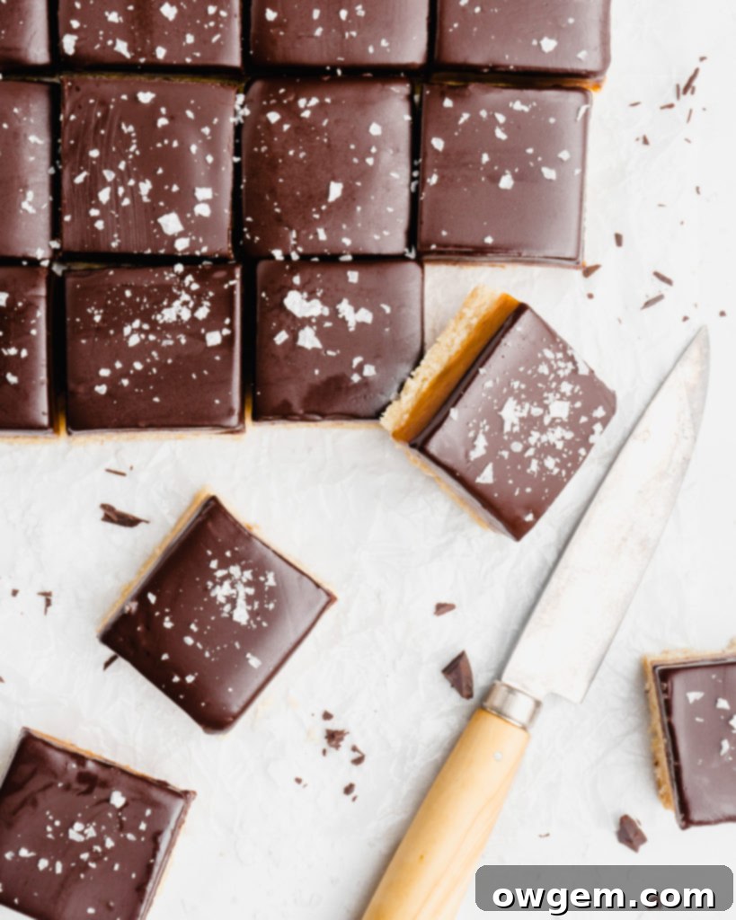 A buttery, rich shortbread layer is topped with a golden creamy caramel layer that is infused with vanilla beans an bourbon, which is further topped by a dark chocolate layer and flaky sea salt.