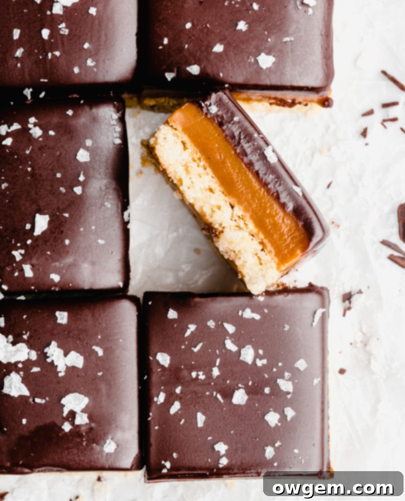 A buttery, rich shortbread layer is topped with a golden creamy caramel layer that is infused with vanilla beans an bourbon, which is further topped by a dark chocolate layer and flaky sea salt.