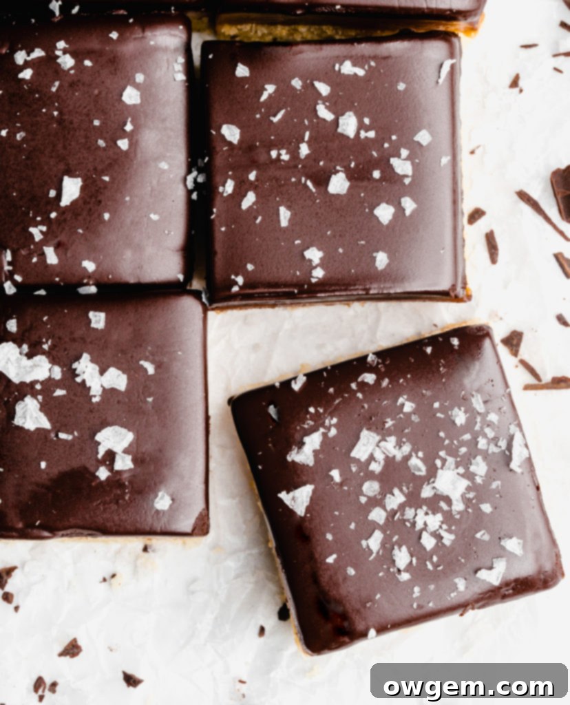 A buttery, rich shortbread layer is topped with a golden creamy caramel layer that is infused with vanilla beans an bourbon, which is further topped by a dark chocolate layer and flaky sea salt.