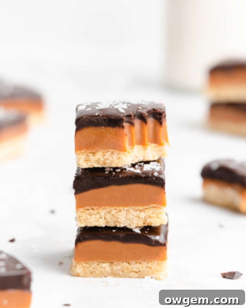 A buttery, rich shortbread layer is topped with a golden creamy caramel layer that is infused with vanilla beans an bourbon, which is further topped by a dark chocolate layer and flaky sea salt.