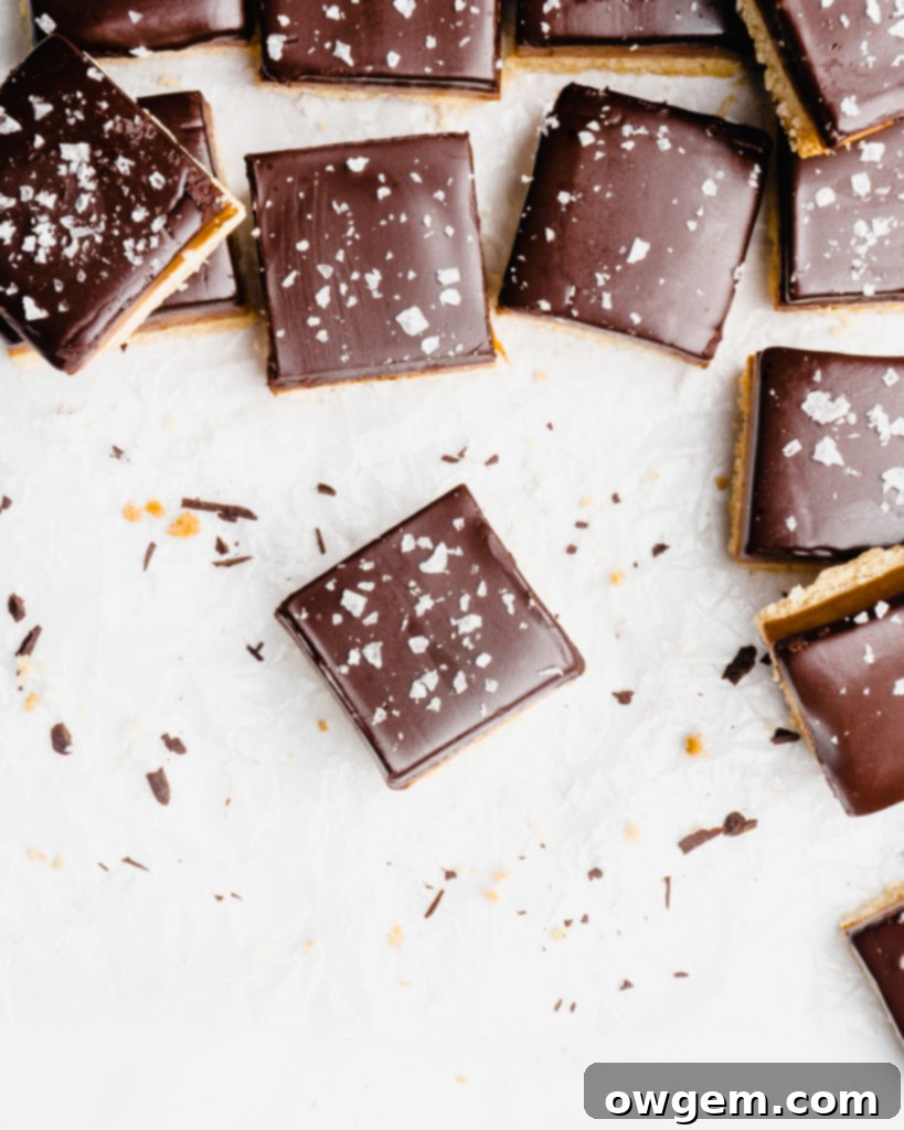 A buttery, rich shortbread layer is topped with a golden creamy caramel layer that is infused with vanilla beans an bourbon, which is further topped by a dark chocolate layer and flaky sea salt.