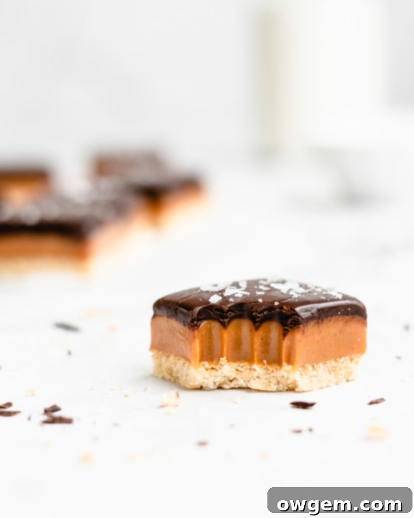 A buttery, rich shortbread layer is topped with a golden creamy caramel layer that is infused with vanilla beans an bourbon, which is further topped by a dark chocolate layer and flaky sea salt.