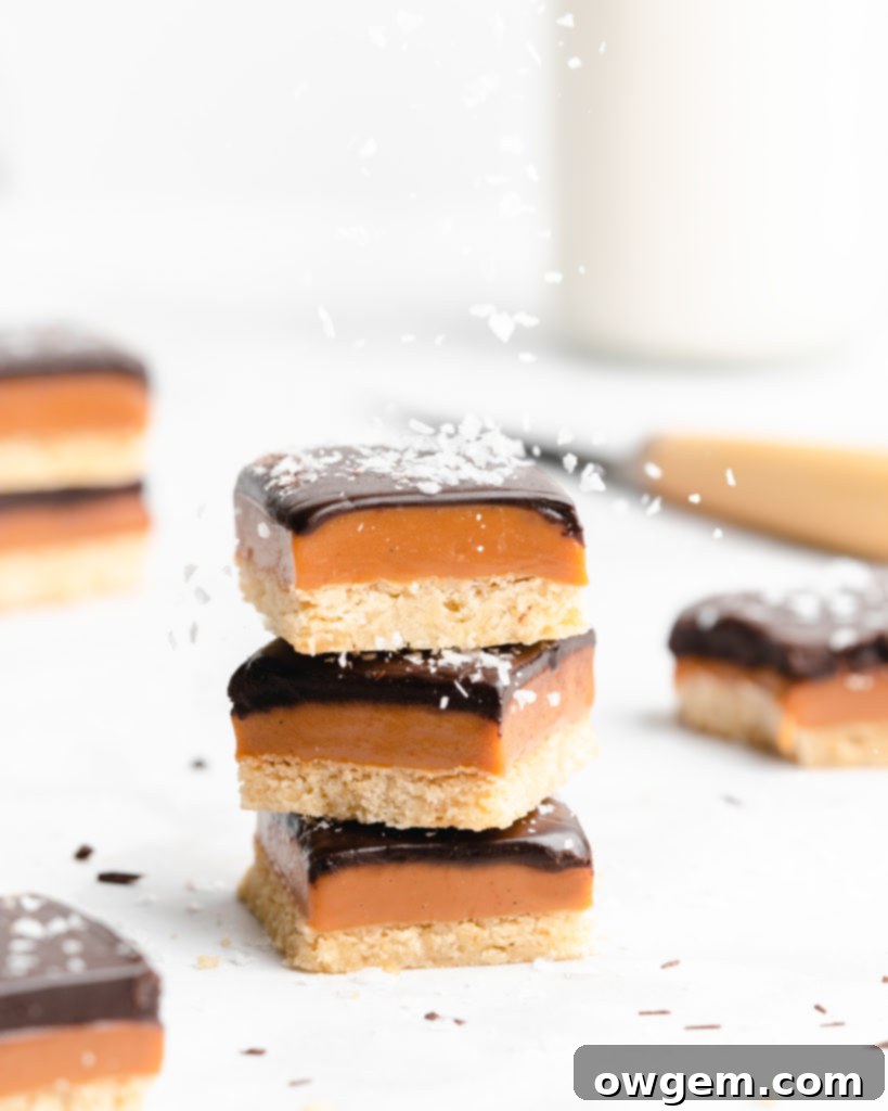 A buttery, rich shortbread layer is topped with a golden creamy caramel layer that is infused with vanilla beans an bourbon, which is further topped by a dark chocolate layer and flaky sea salt.