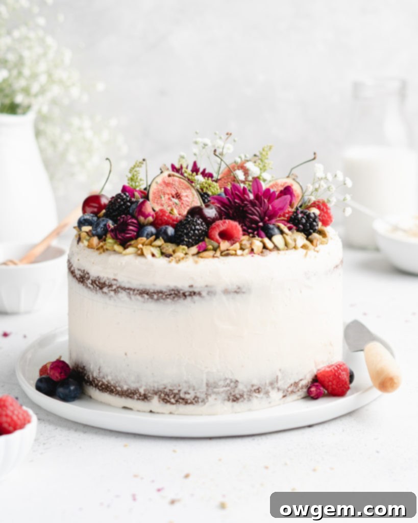 Pistachio cake styled with honey rosewater swiss meringue buttercream, featuring a close view of the frosting texture
