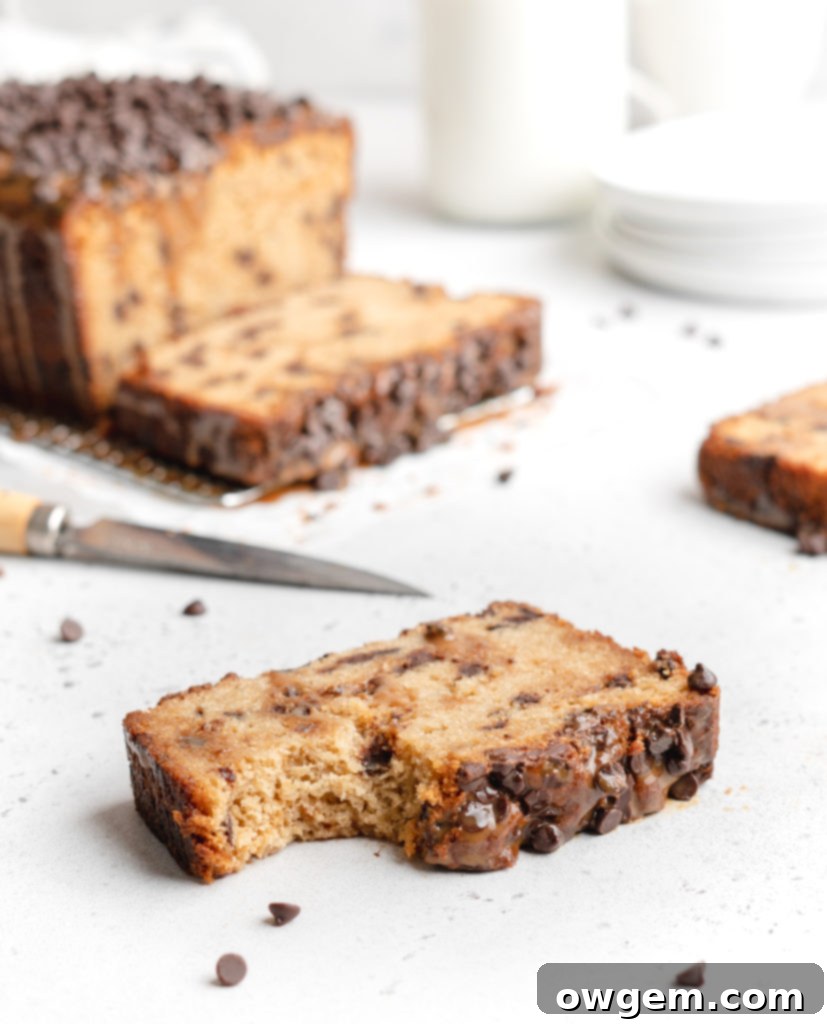 Half of the chocolate chip loaf batter in a loaf pan, ready for dulce de leche