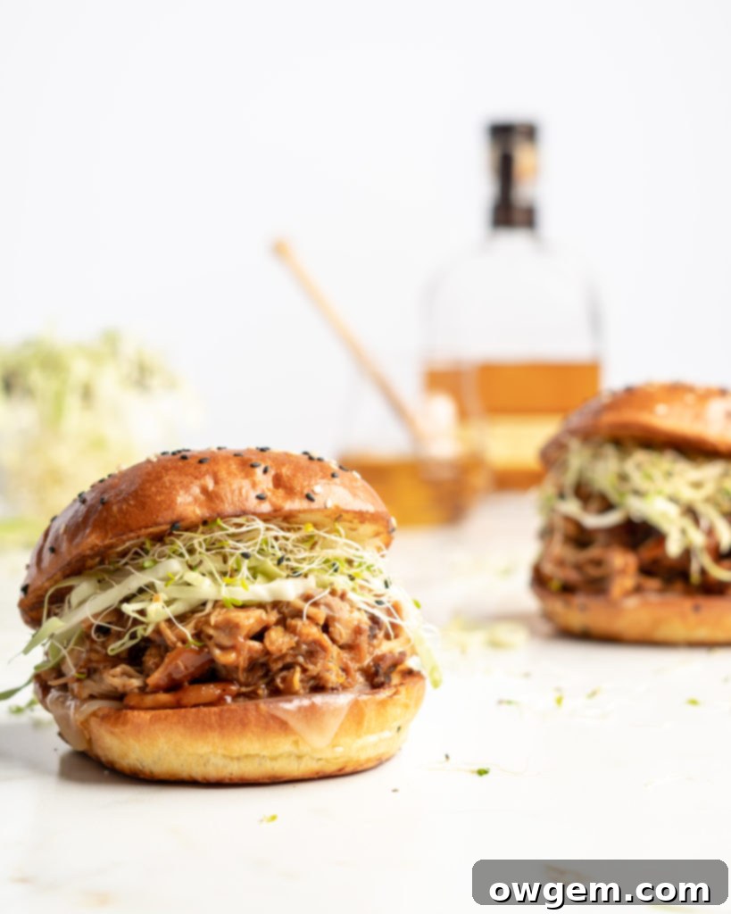Slow cooker BBQ pulled chicken sandwich with coleslaw.