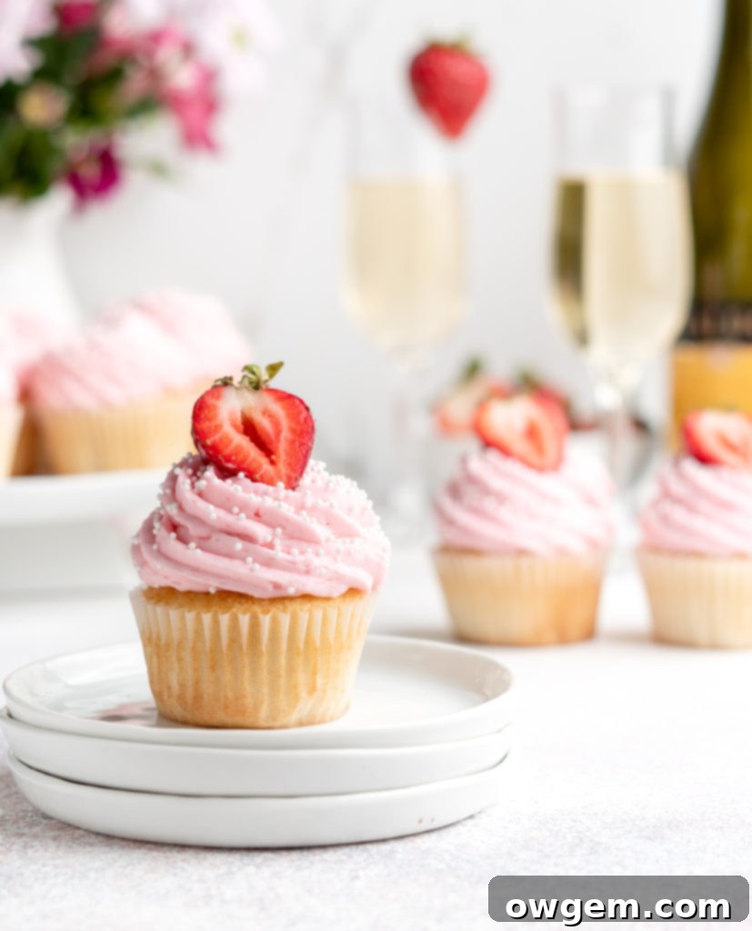 Bubbling with fun flavors, these Prosecco Cupcakes are topped with a fruity strawberry buttercream