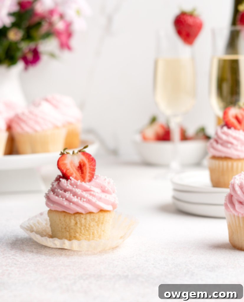 Bubbling with fun flavors, these Prosecco Cupcakes are topped with a fruity strawberry buttercream