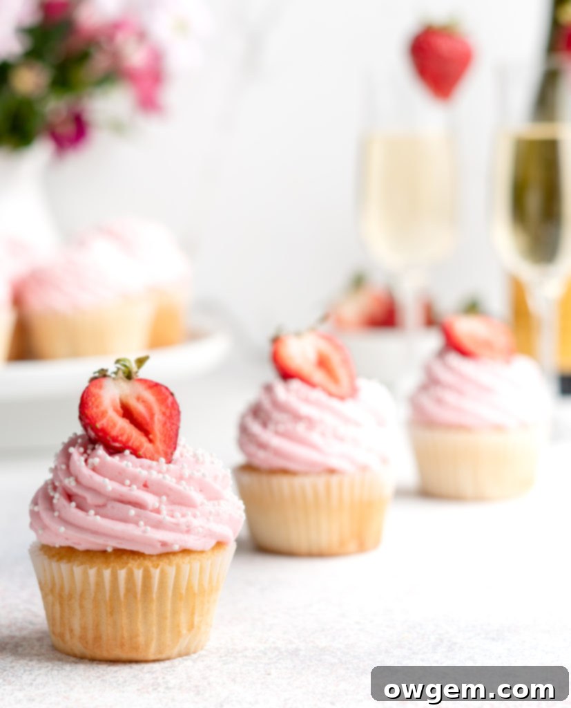 Bubbling with fun flavors, these Prosecco Cupcakes are topped with a fruity strawberry buttercream