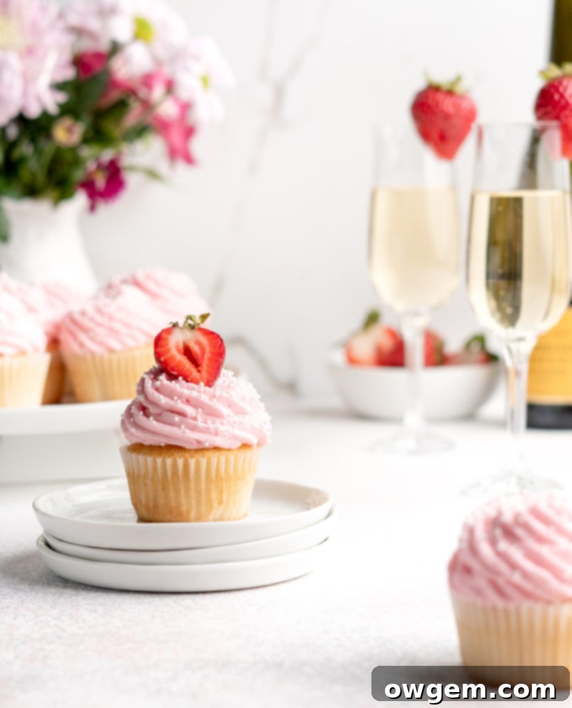 Bubbling with fun flavors, these Prosecco Cupcakes are topped with a fruity strawberry buttercream