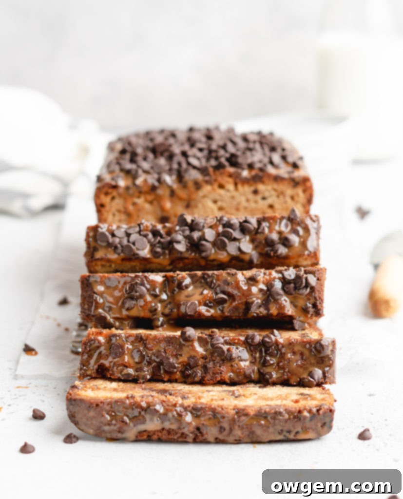 A deliciously moist chocolate chip loaf cake is swirled with dulce de leche, showcasing a rich and inviting texture.