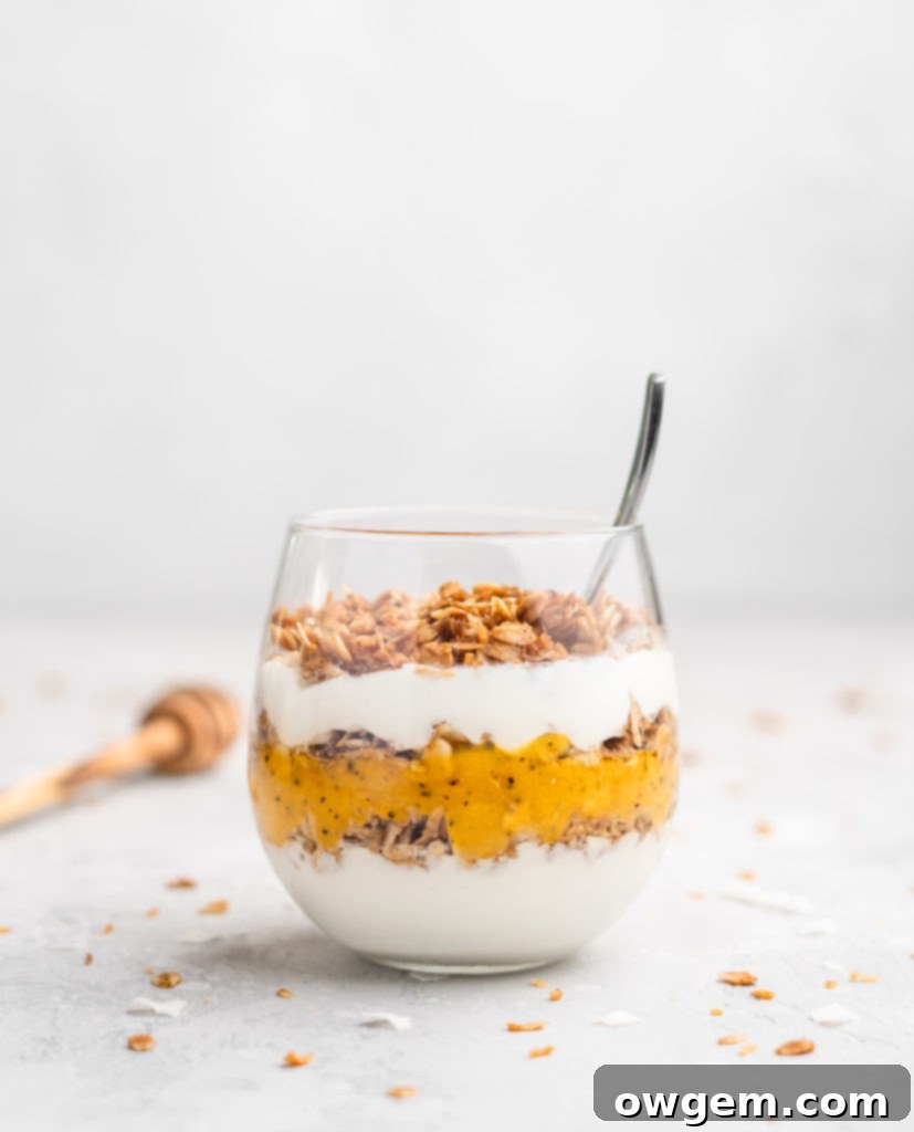 Layers of passion fruit and mango puree, yogurt, and coconut granola make up with tropical yogurt parfait