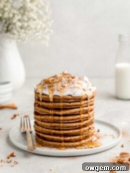 Cinnamon Bun Pancakes with Cream Cheese Frosting, a delightful breakfast.