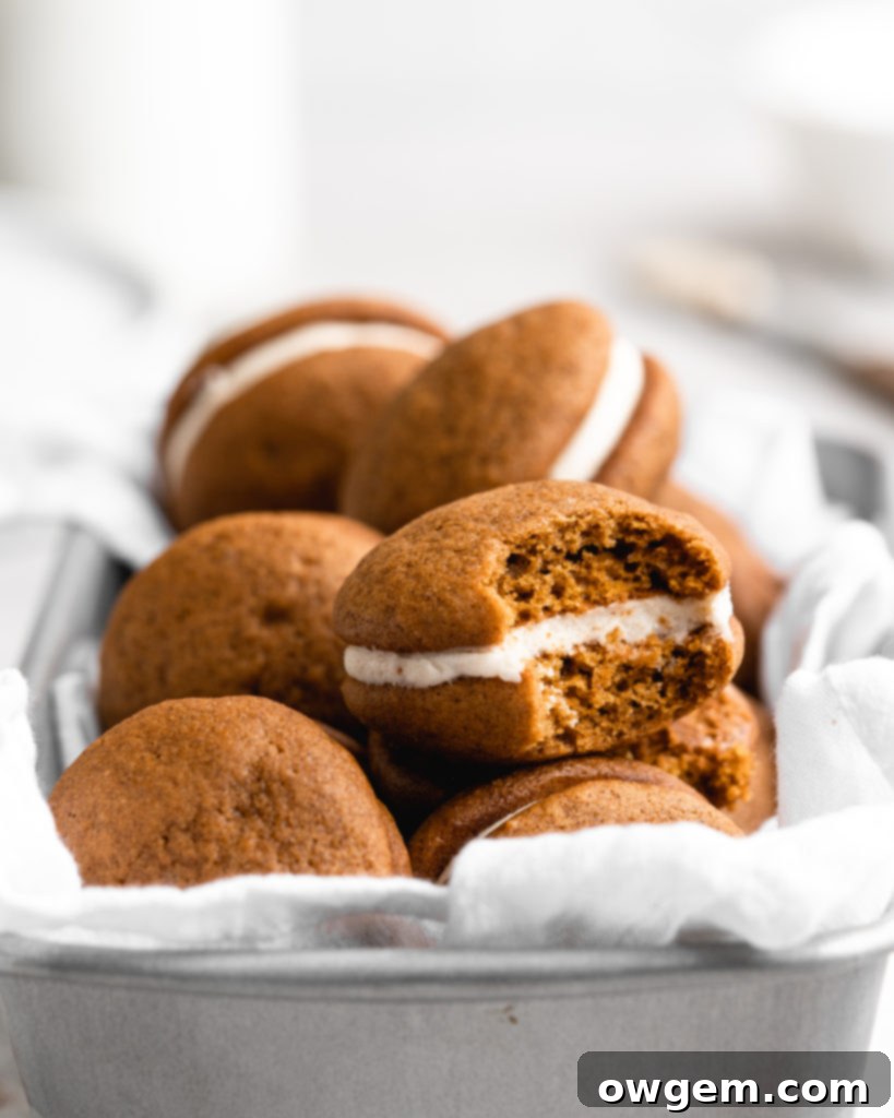 These Pumpkin Whoopie Pies feature Brown Butter Cream Cheese Filling is sandwiched between 2 fluffy pumpkin cookies