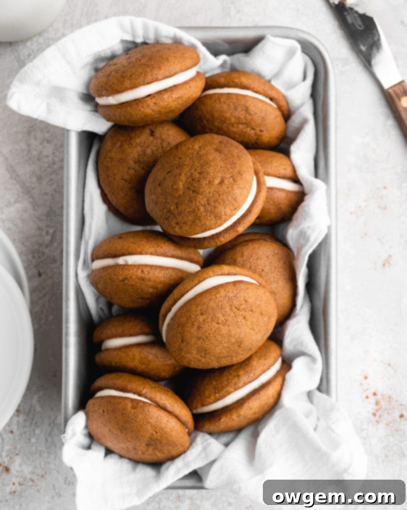 These Pumpkin Whoopie Pies feature Brown Butter Cream Cheese Filling is sandwiched between 2 fluffy pumpkin cookies