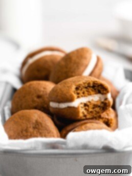 These Pumpkin Whoopie Pies feature Brown Butter Cream Cheese Filling is sandwiched between 2 fluffy pumpkin cookies