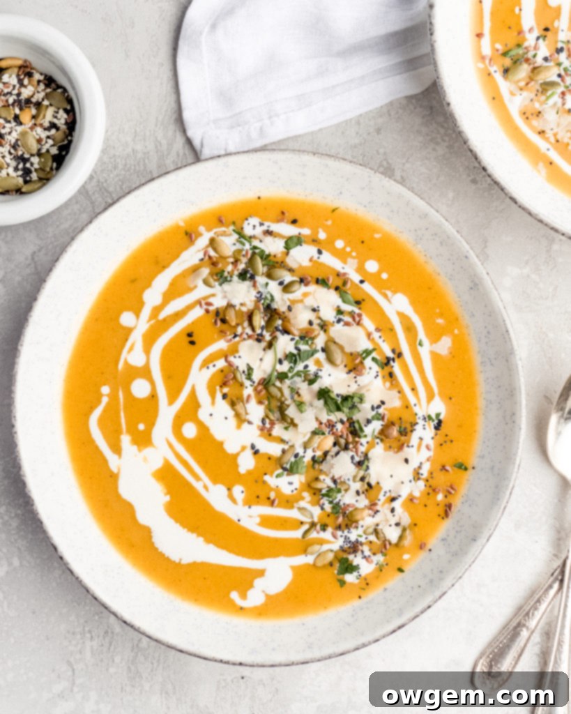 A close-up of the delicious and creamy Bourbon Butternut Squash Soup, showing its inviting texture and color.