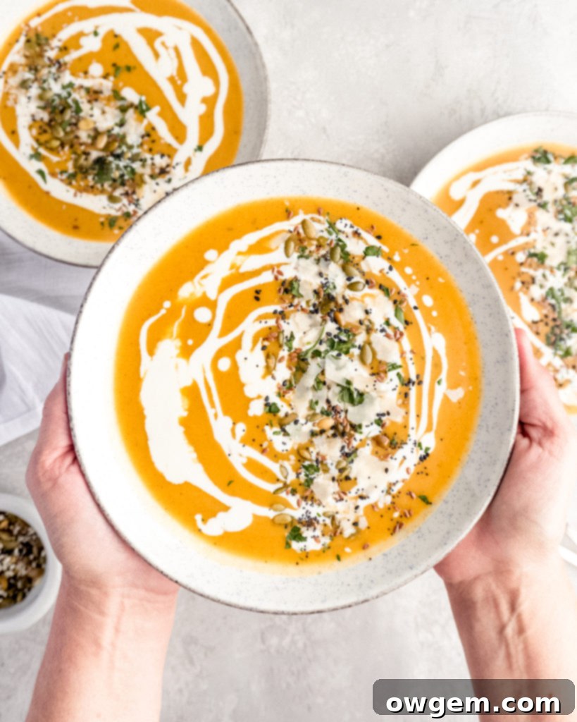 Blending the butternut squash soup to a smooth, creamy consistency is key for a perfect finish.