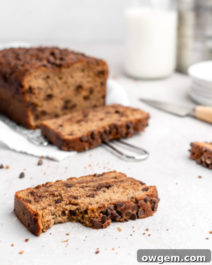 Close-up of a slice of Tahini Chocolate Chip Banana Bread showing its moist texture