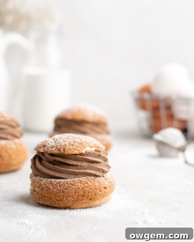Crispy craquelin-topped mocha cream puffs filled with creamy chocolate espresso pastry cream