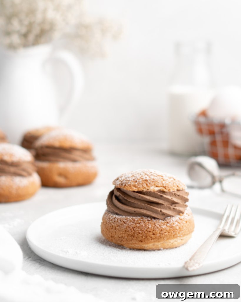 Mocha cream puffs baking in the oven with craquelin topping