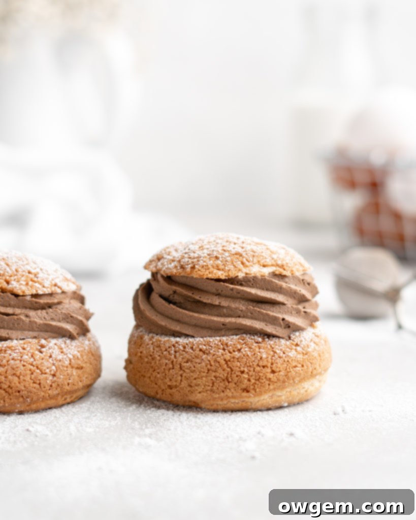 Mocha cream puffs with craquelin topping cooling on a rack