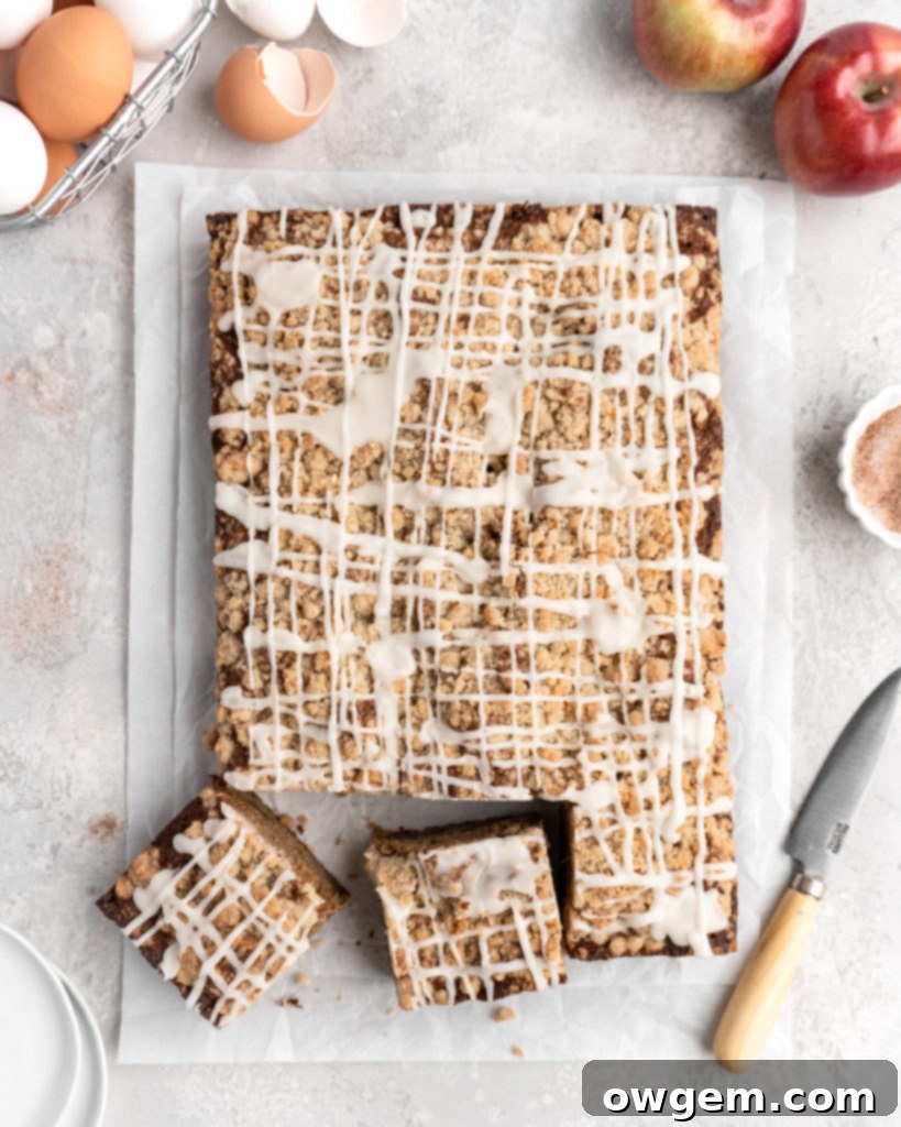 The finished Apple Cinnamon Spice Cake, generously drizzled with the sweet and aromatic bourbon vanilla glaze, ready to be served