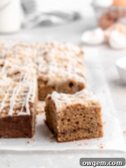 This Apple Cinnamon Spice Cake features a moist, perfectly-spiced cake that is speckled with apples and topped with a buttery streusel topping
