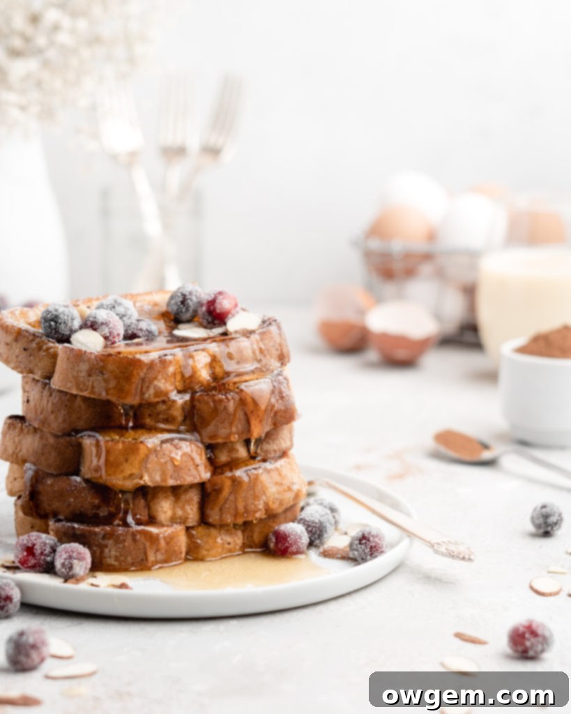 Spiced Eggnog French Toast with Bourbon-Infused Maple Syrup 2 This delicious Christmas-themed French Toast is soaked in an eggnog custard and topped with a buttered maple bourbon syrup