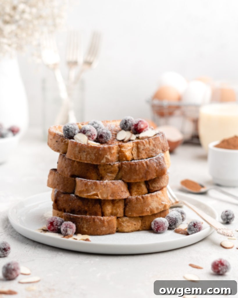 This delicious Christmas-themed French Toast is soaked in an eggnog custard and topped with a buttered maple bourbon syrup