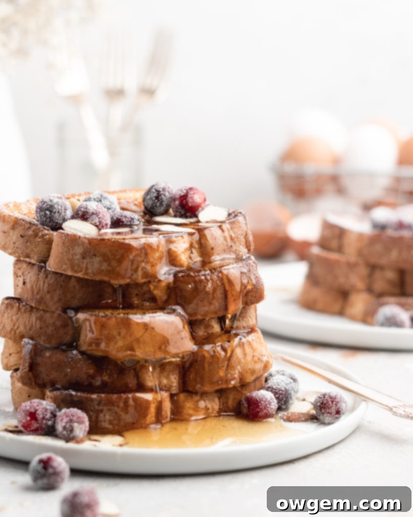 This delicious Christmas-themed French Toast is soaked in an eggnog custard and topped with a buttered maple bourbon syrup