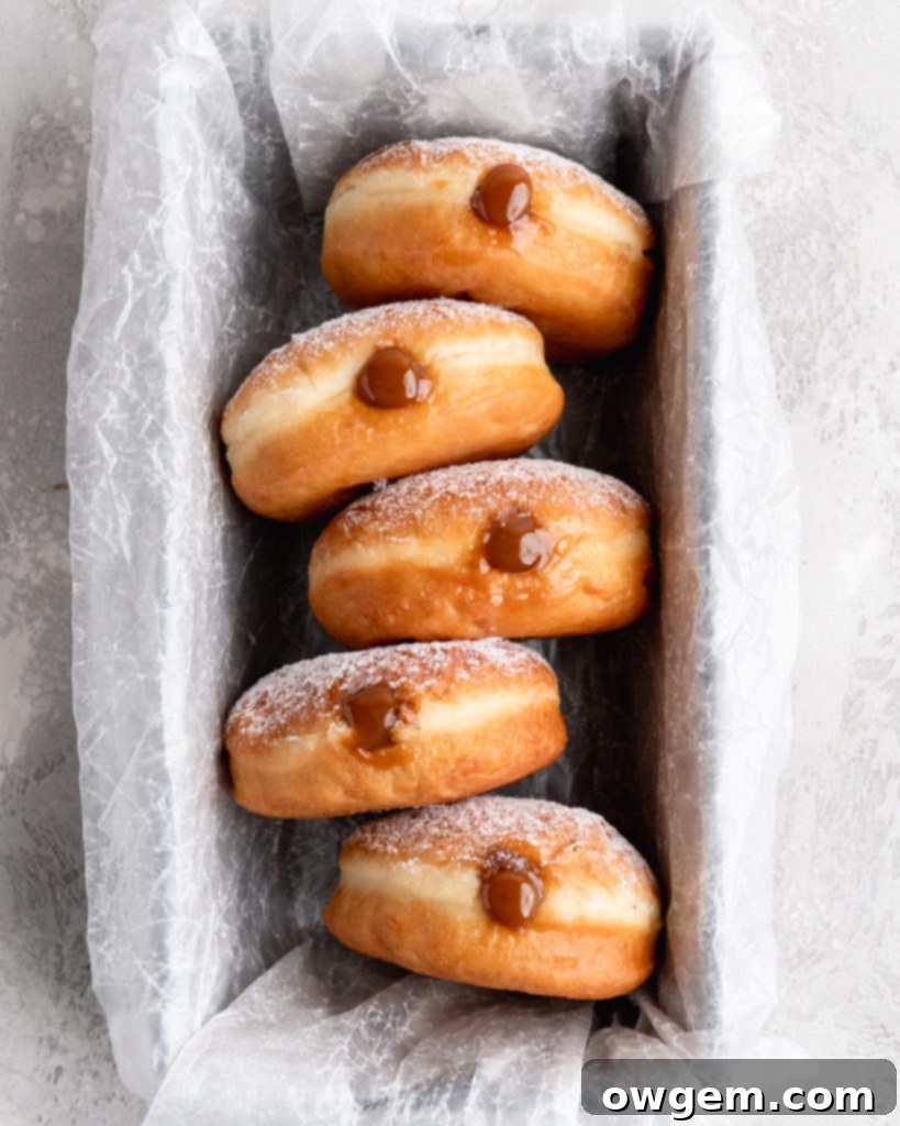 Filled with creamy, deeply sweet dulce de leche, these filled yeast donuts are crazy delicious