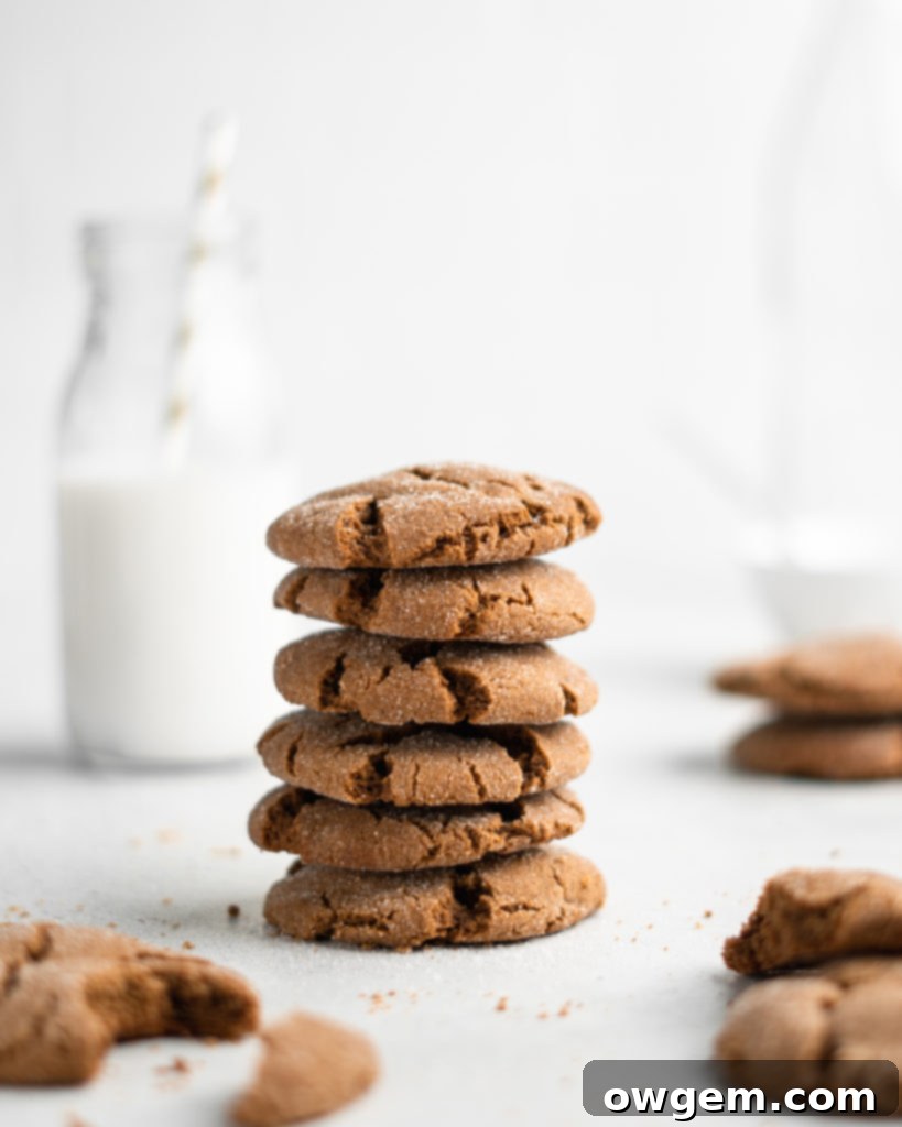 Super chewy and full of Christmas flavor, these crackly topped Cardamom Gingerbread Molasses Cookies are a breeze to make!