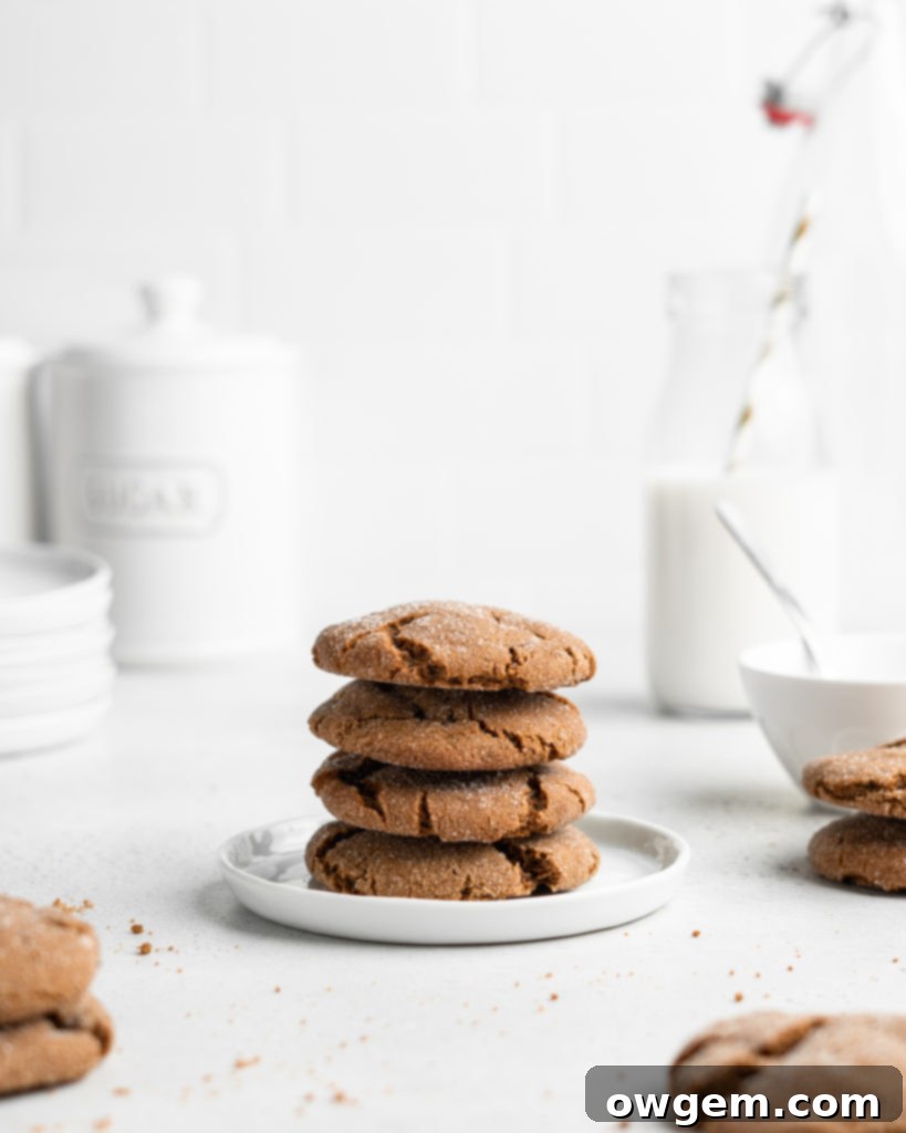 Super chewy and full of Christmas flavor, these crackly topped Cardamom Gingerbread Molasses Cookies are a breeze to make!