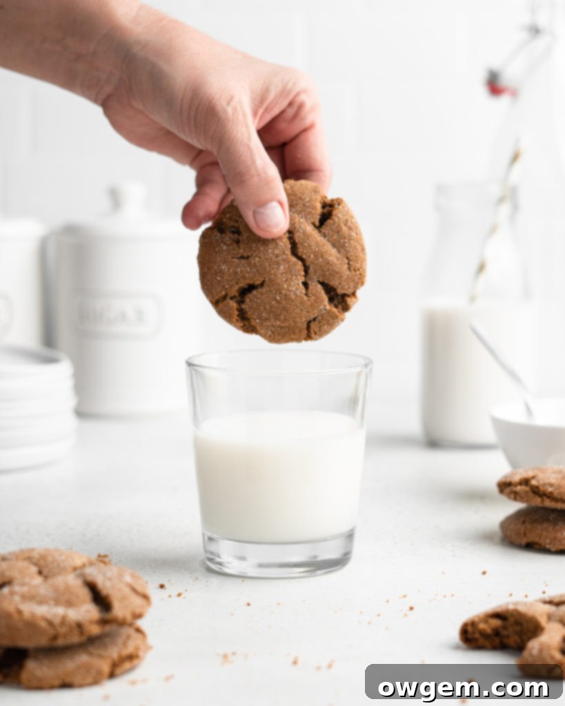 Super chewy and full of Christmas flavor, these crackly topped Cardamom Gingerbread Molasses Cookies are a breeze to make!